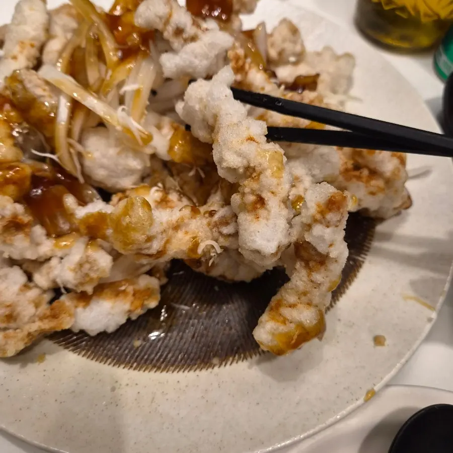 Black vinegar tangsuyuk mixed with extra sauce poured on top