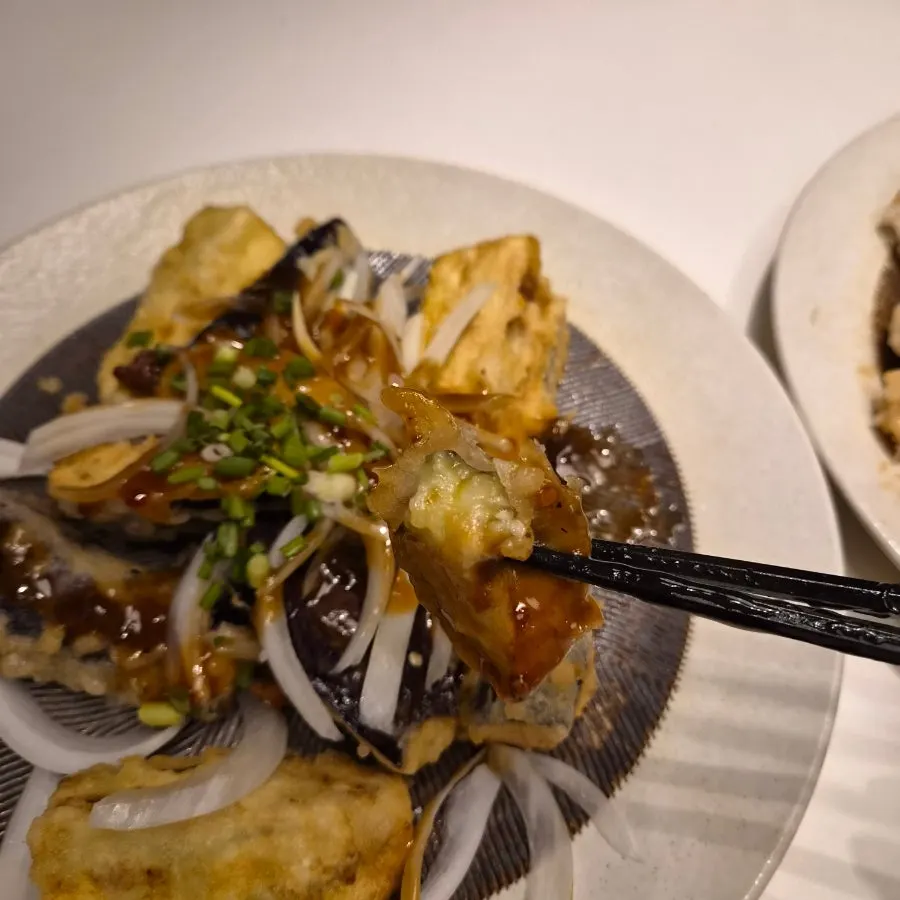 Close-up of eohyang gaji coated in sauce