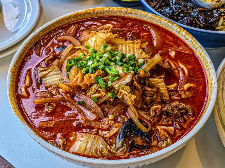 A bowl of woo-samgyeop beef jjamppong with a generous amount of meat