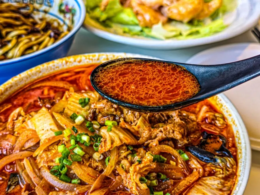 Close-up of the deep red jjamppong broth