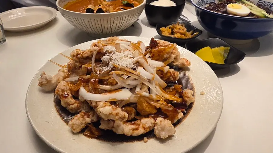 BUUK jjajangmyeon, large, topped with boiled egg and julienned cucumber