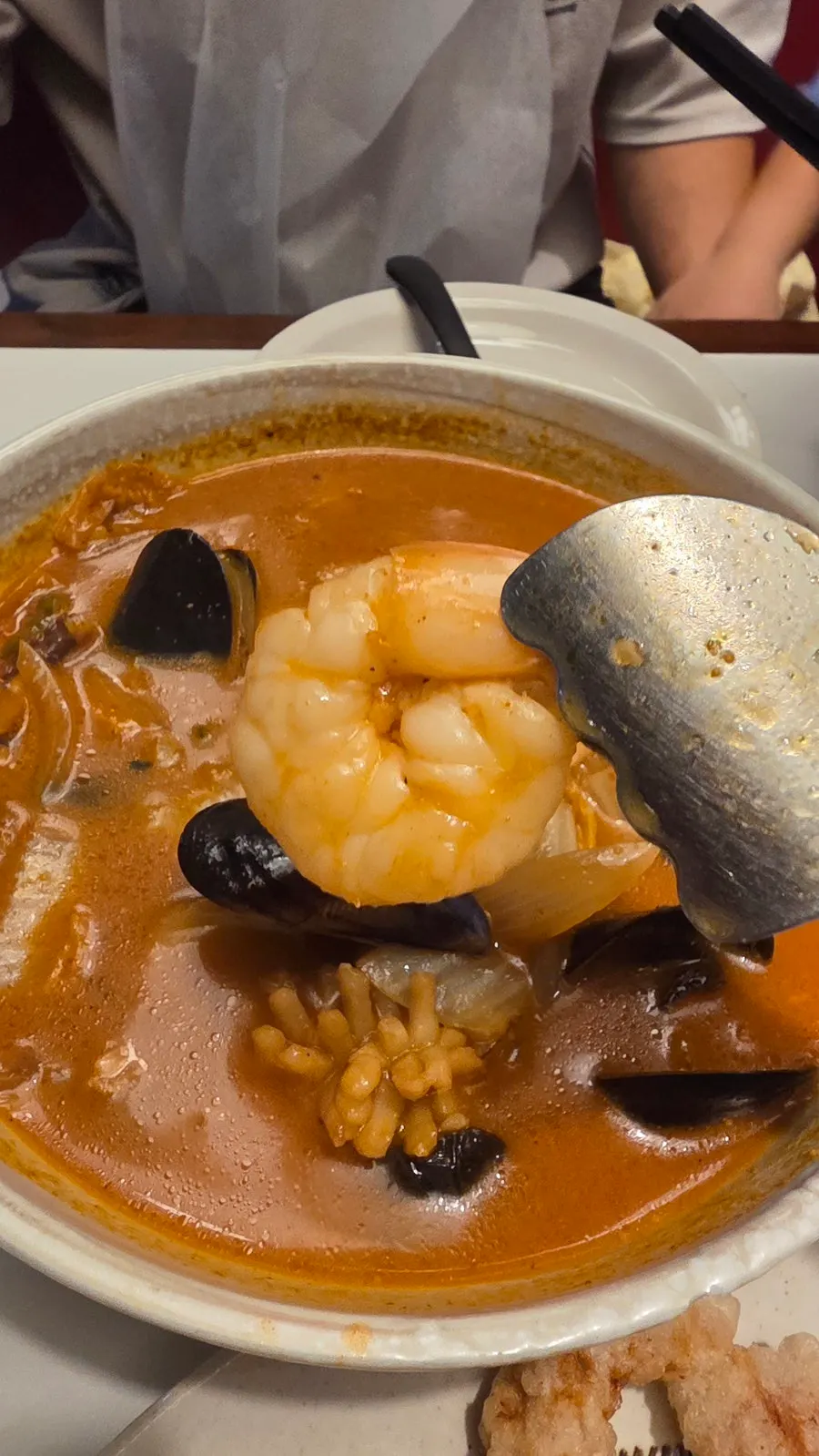 Bowl of seafood jjamppong rice loaded with mussels