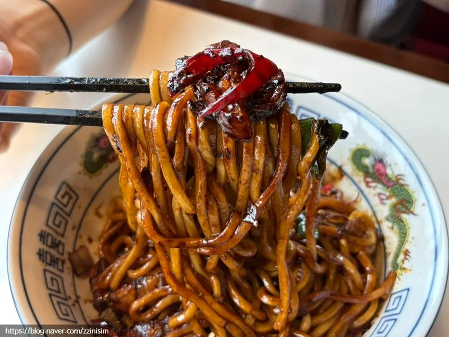 A forkful of mixed ganjajang noodles
