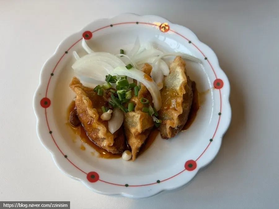 Nearly emptied plate of seafood nurungji-tang