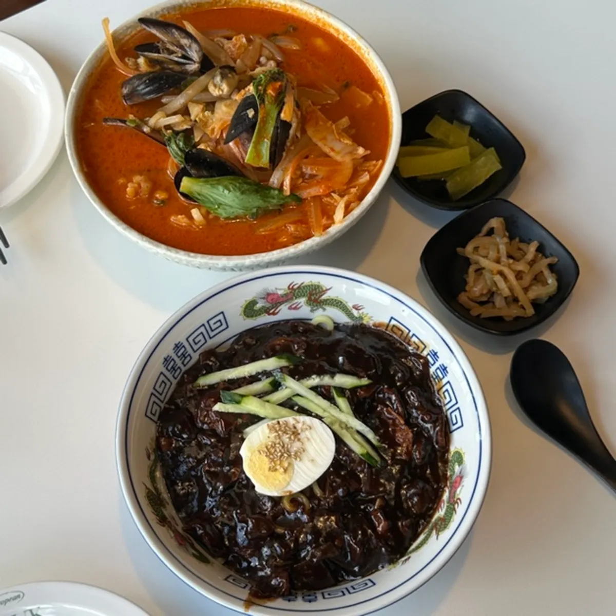 Table set with jajangmyeon and seafood jjamppong