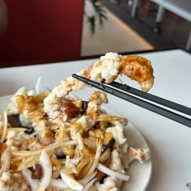 Black vinegar pork loin tangsuyuk served with sauce poured over