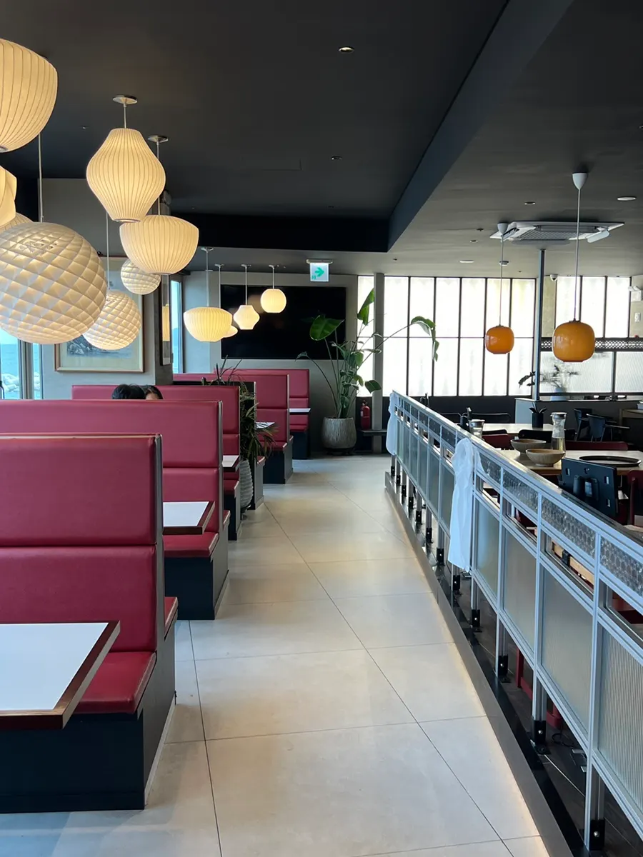 Modern dining hall with red and green accent points
