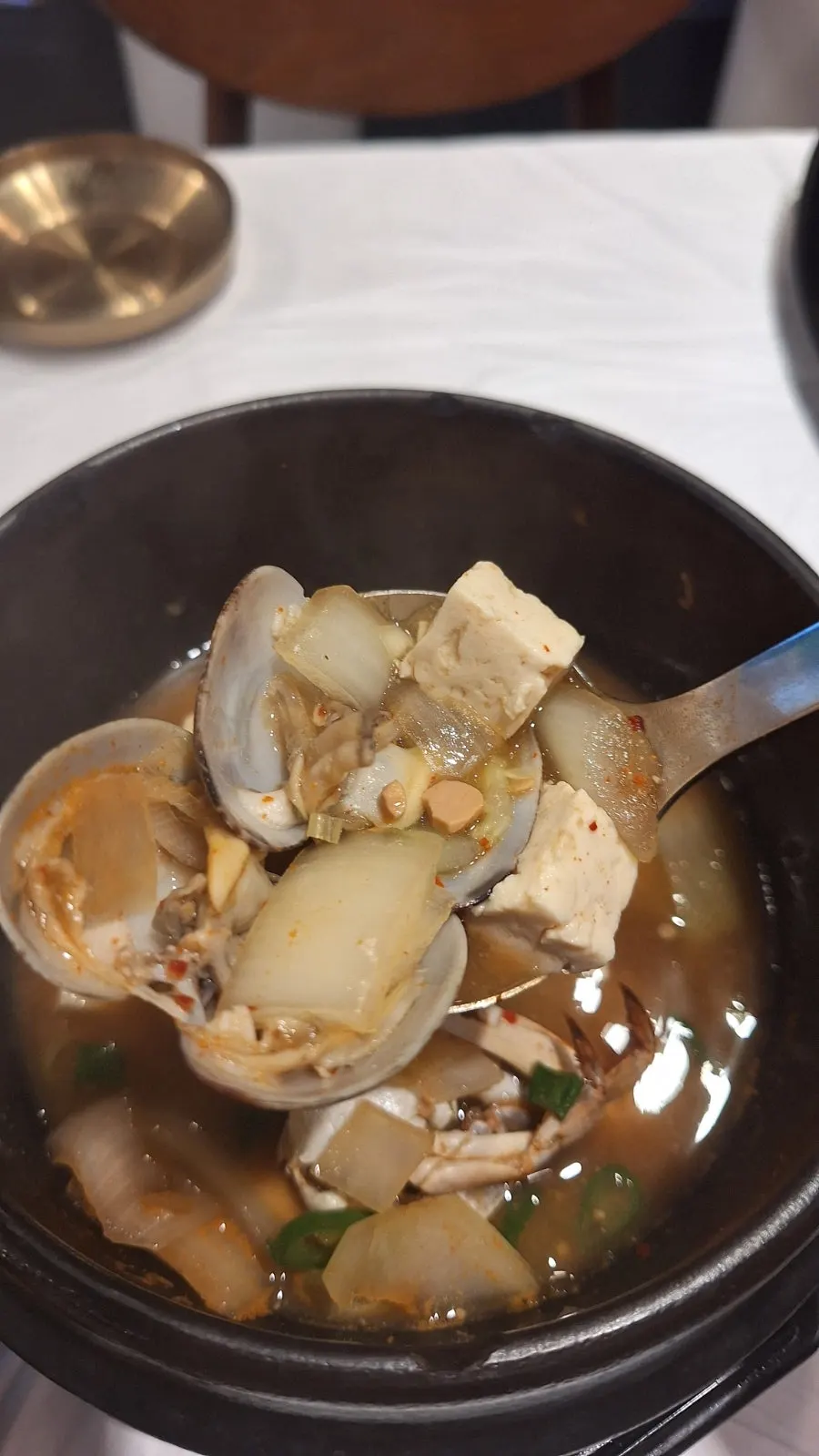 Ttukbaegi doenjang jjigae with crab and clams
