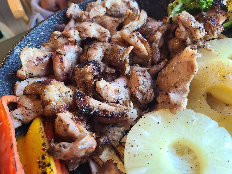 Grilled chicken thigh barbecue served ready to eat