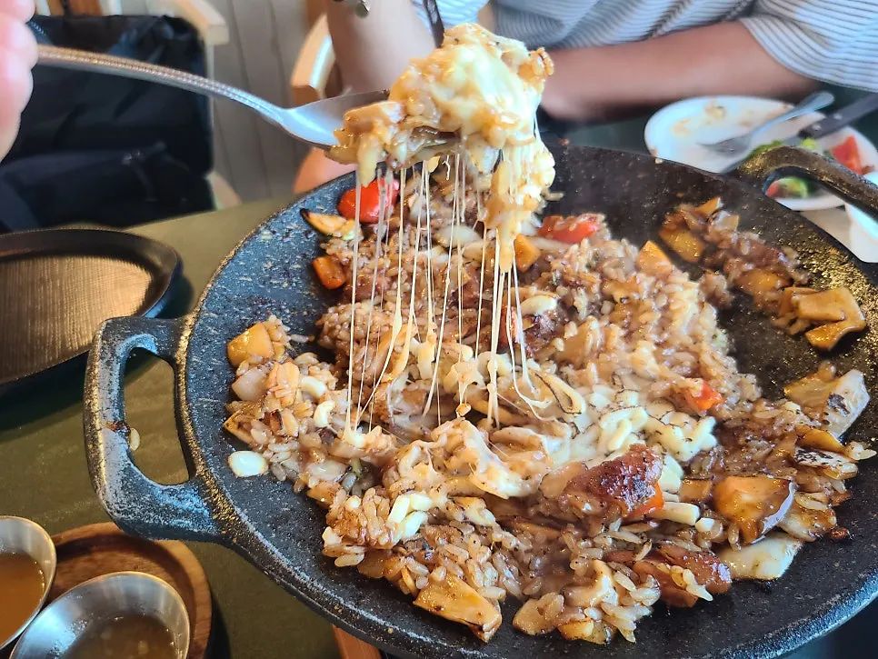 Spicy fried rice topped with cheese