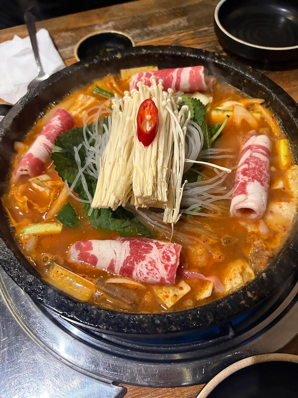 Hanwoo gopchang jeongol served generously on a hot stone plate