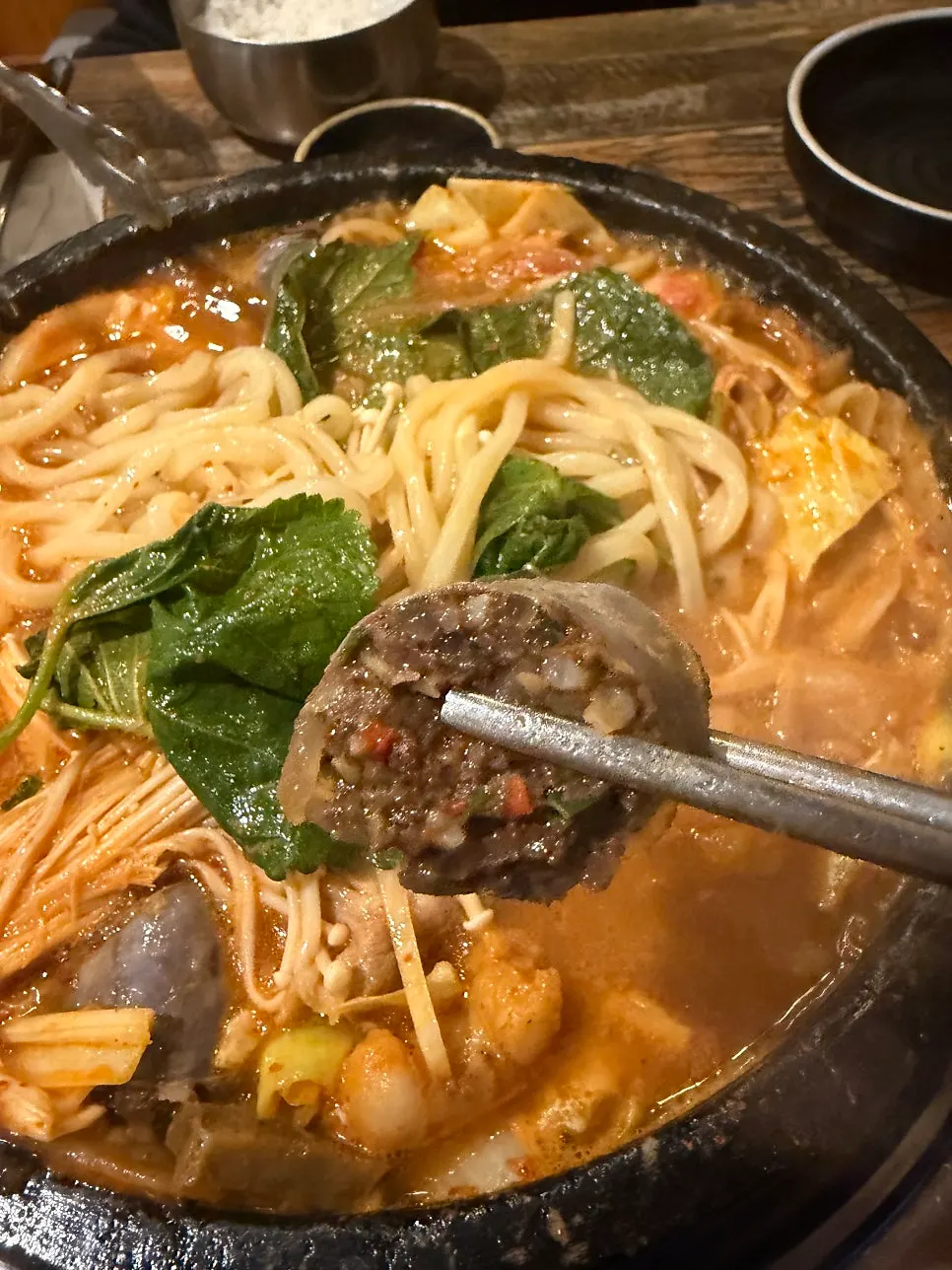 Chewy hanwoo tripe lifted out of the hotpot