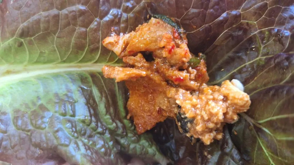 Spicy pork stir-fry served alongside ssamjang