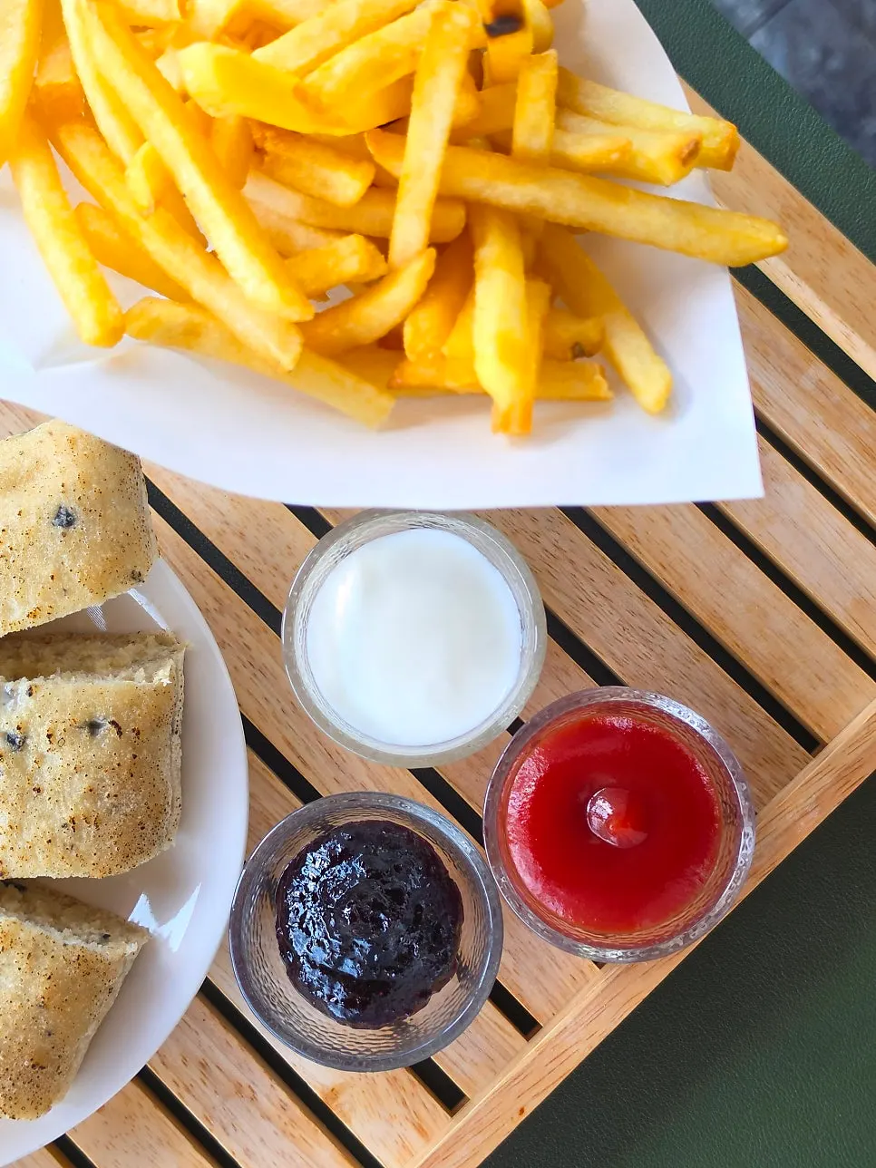 Plate of yogurt, jam, and ketchup sauces