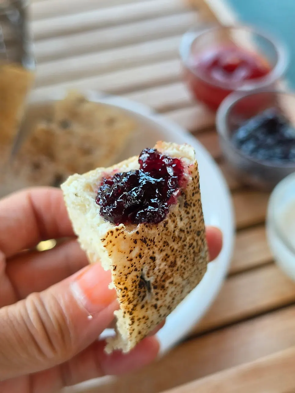 A piece of ciabatta topped with jam