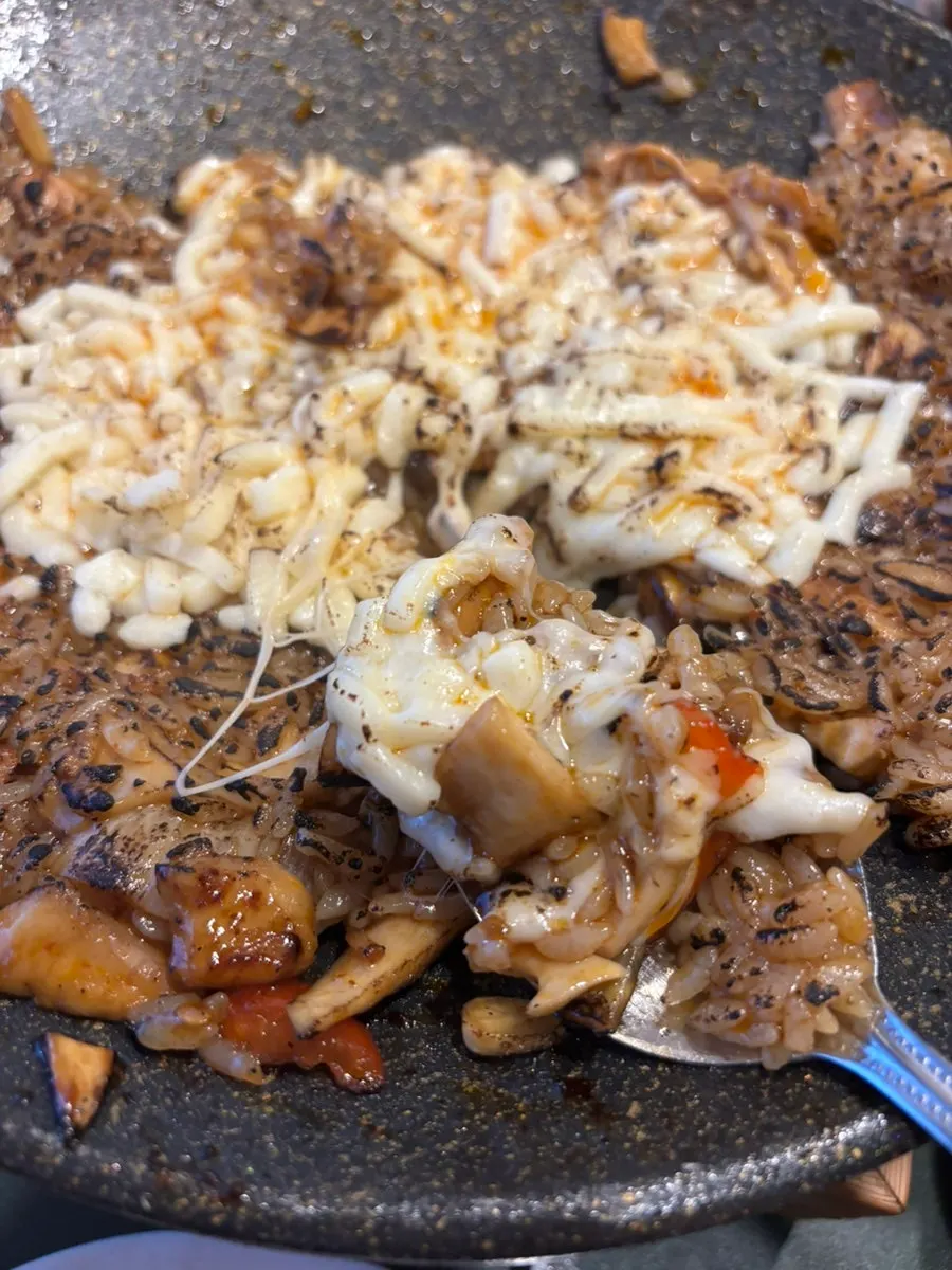 Fried rice topped with cheese