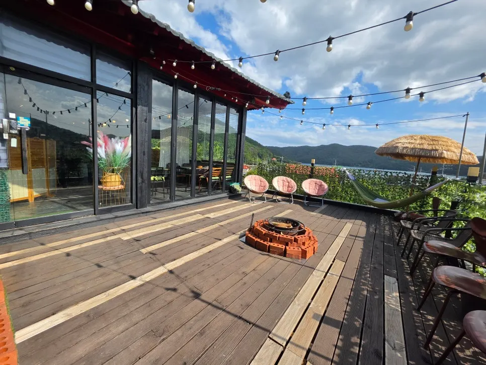 Terrace with a campfire pit and hammock