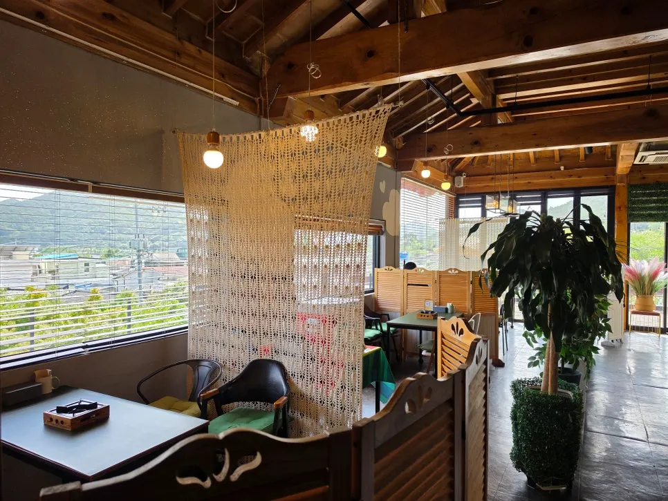 Interior with wooden ceiling and potted plants