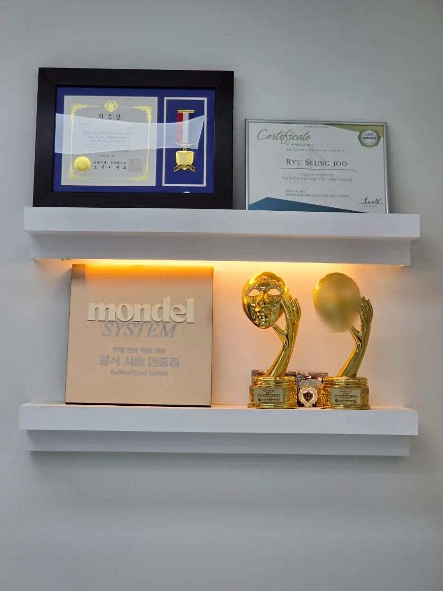 Award trophies and plaques displayed at the entrance