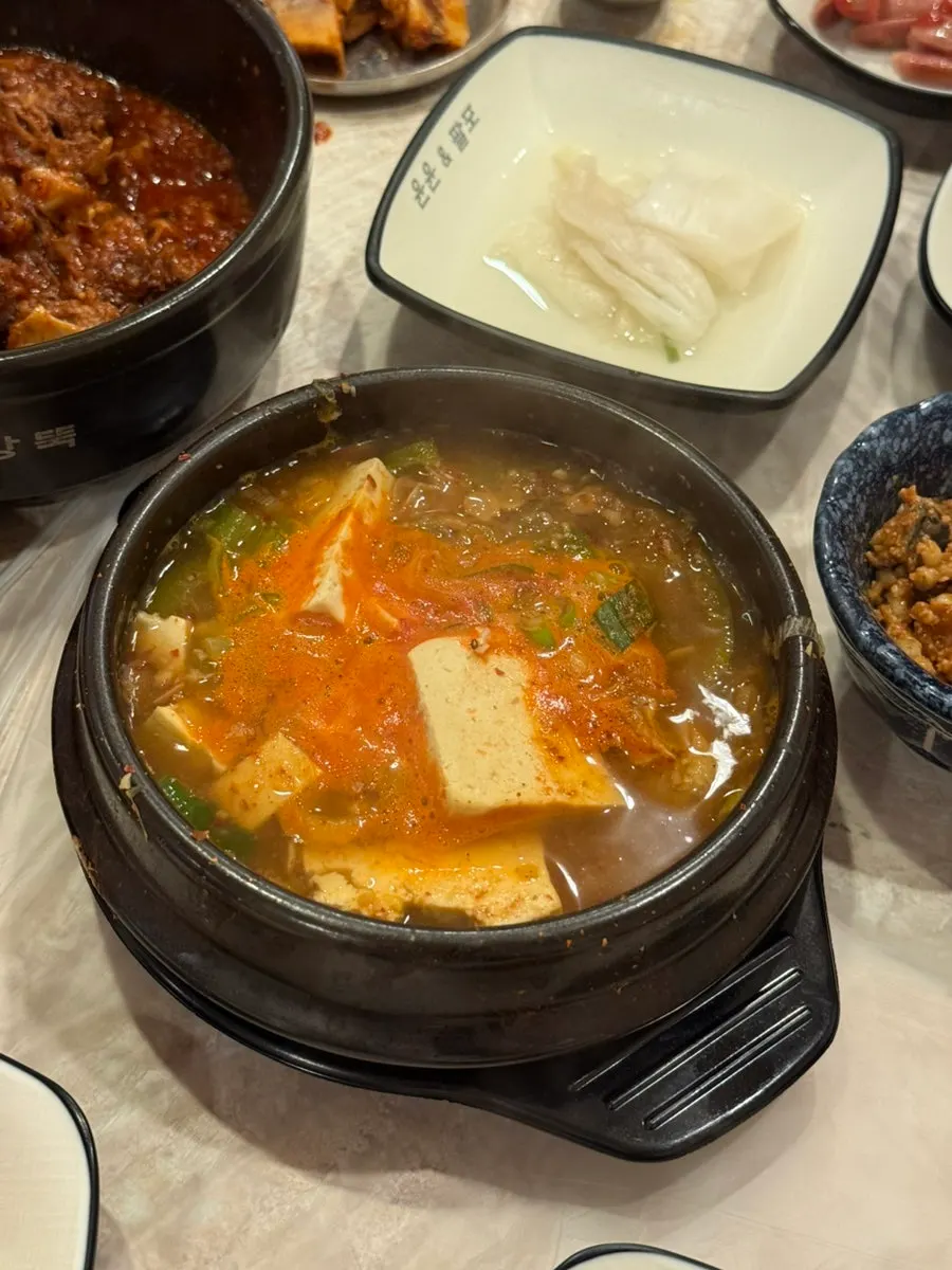 Spicy pork, braised kimchi, chive pancake, and tofu kimchi