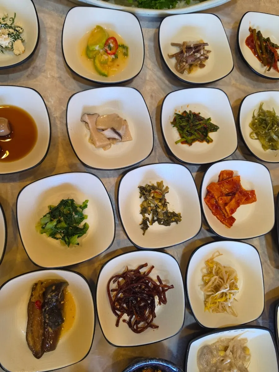 Plates of pancakes and seasoned salads