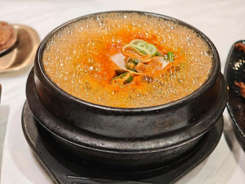 Freshly cooked seafood doenjang stew and grilled fish