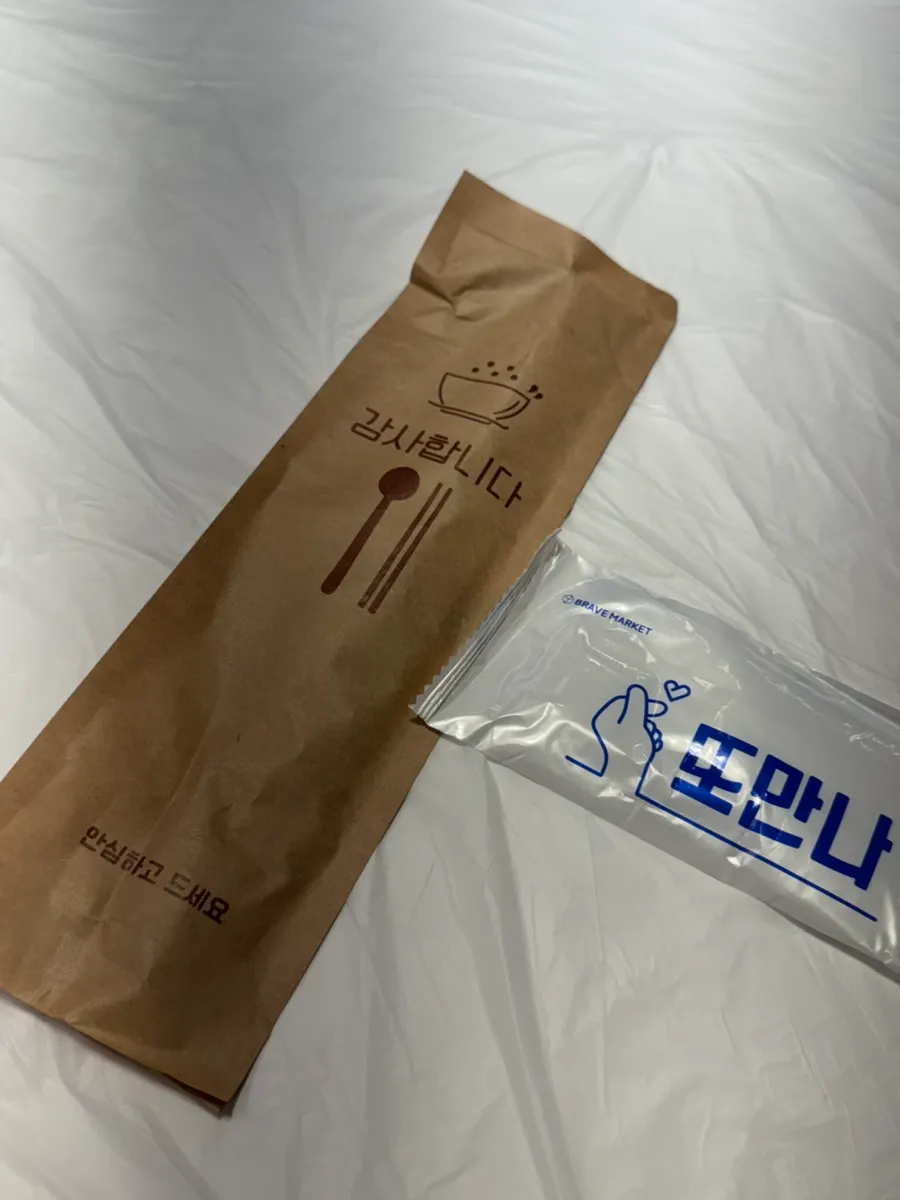 Spoon and chopsticks in a paper pouch at Yun Sikdang