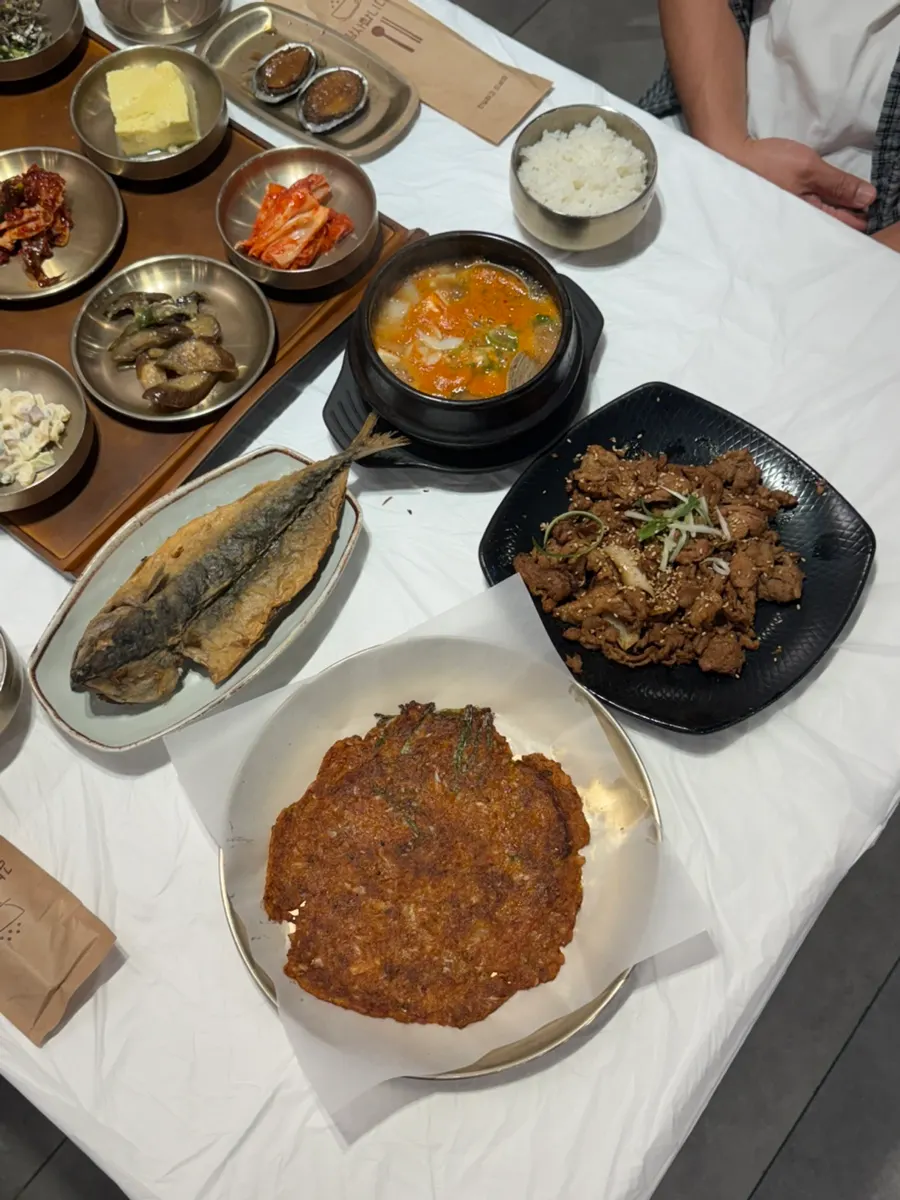 Table packed with side dishes for a set meal for two at Yun Sikdang