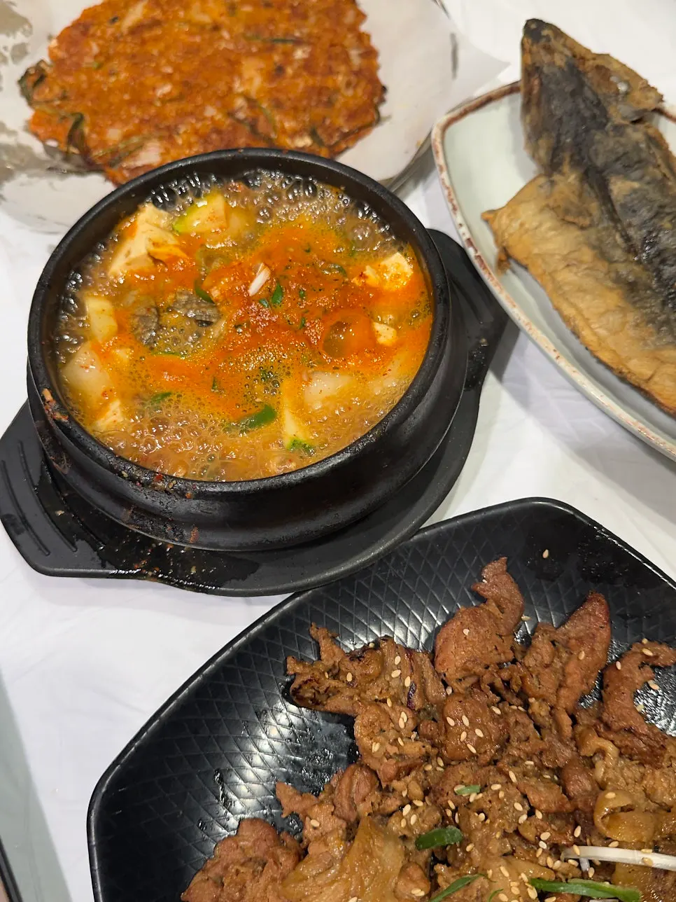 Kimchi pancake, grilled fish, and grilled bulgogi spread