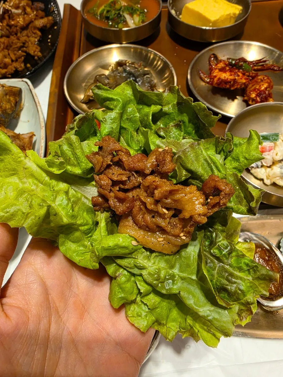 A piece of grilled mackerel with the meat picked off