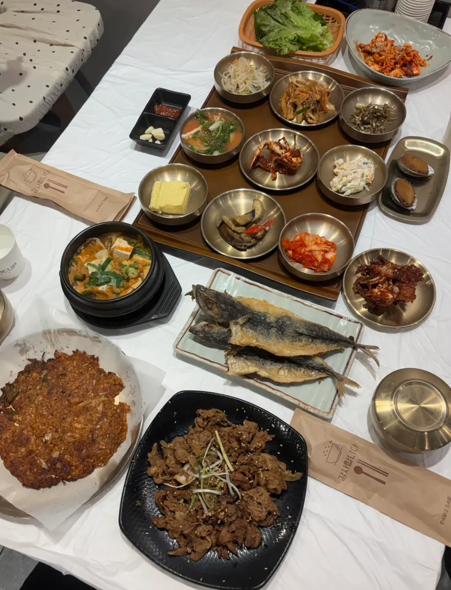 Set meal spread with added grilled fish and seasoned crab