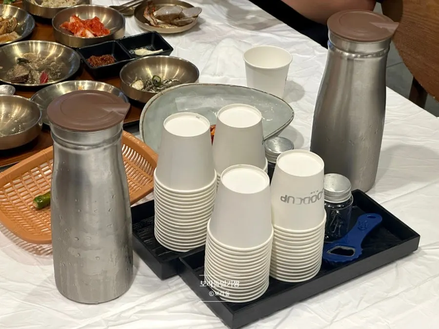 Water and cups set out on a Yun Sikdang table
