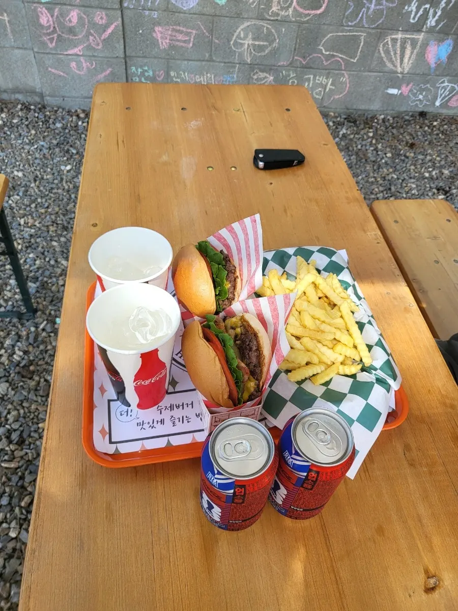 Table spread with the Masian Classic and Hawaiian BBQ burgers