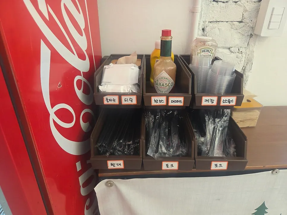 Sauce and utensil station at the center of the store
