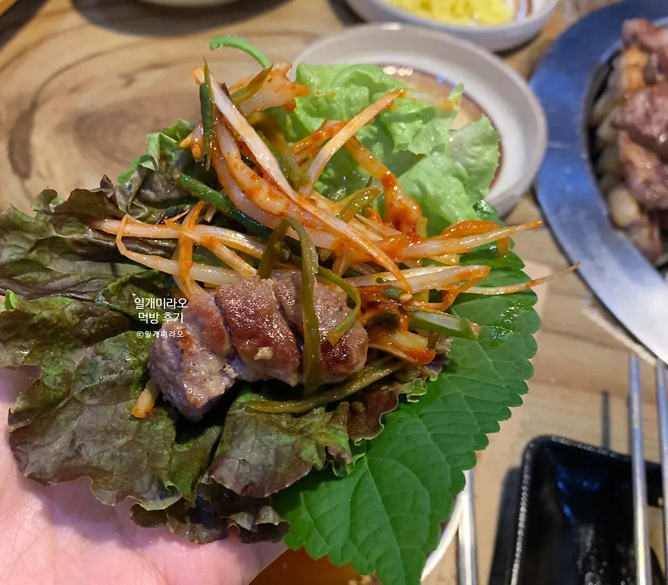 Grilled pork neck served at the table