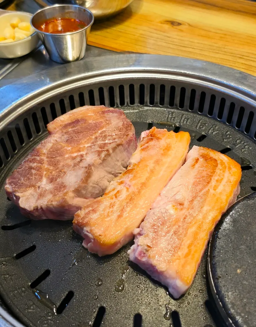 Thickly sliced aged raw pork neck