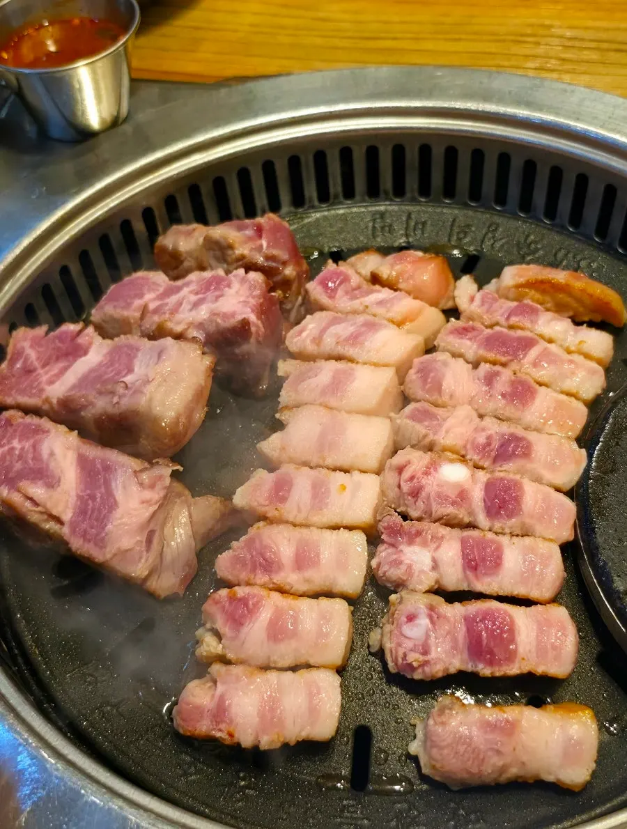 Raw meat neatly stacked on a plate