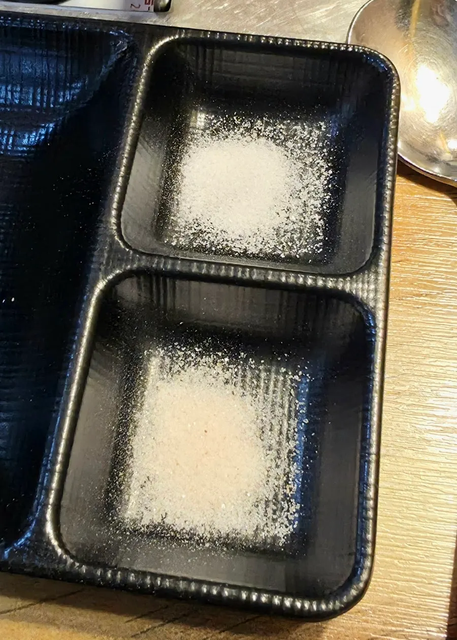 A two-compartment plate of king salt for dipping