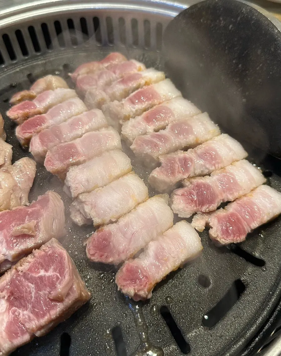 A golden-brown piece of grilled pork belly