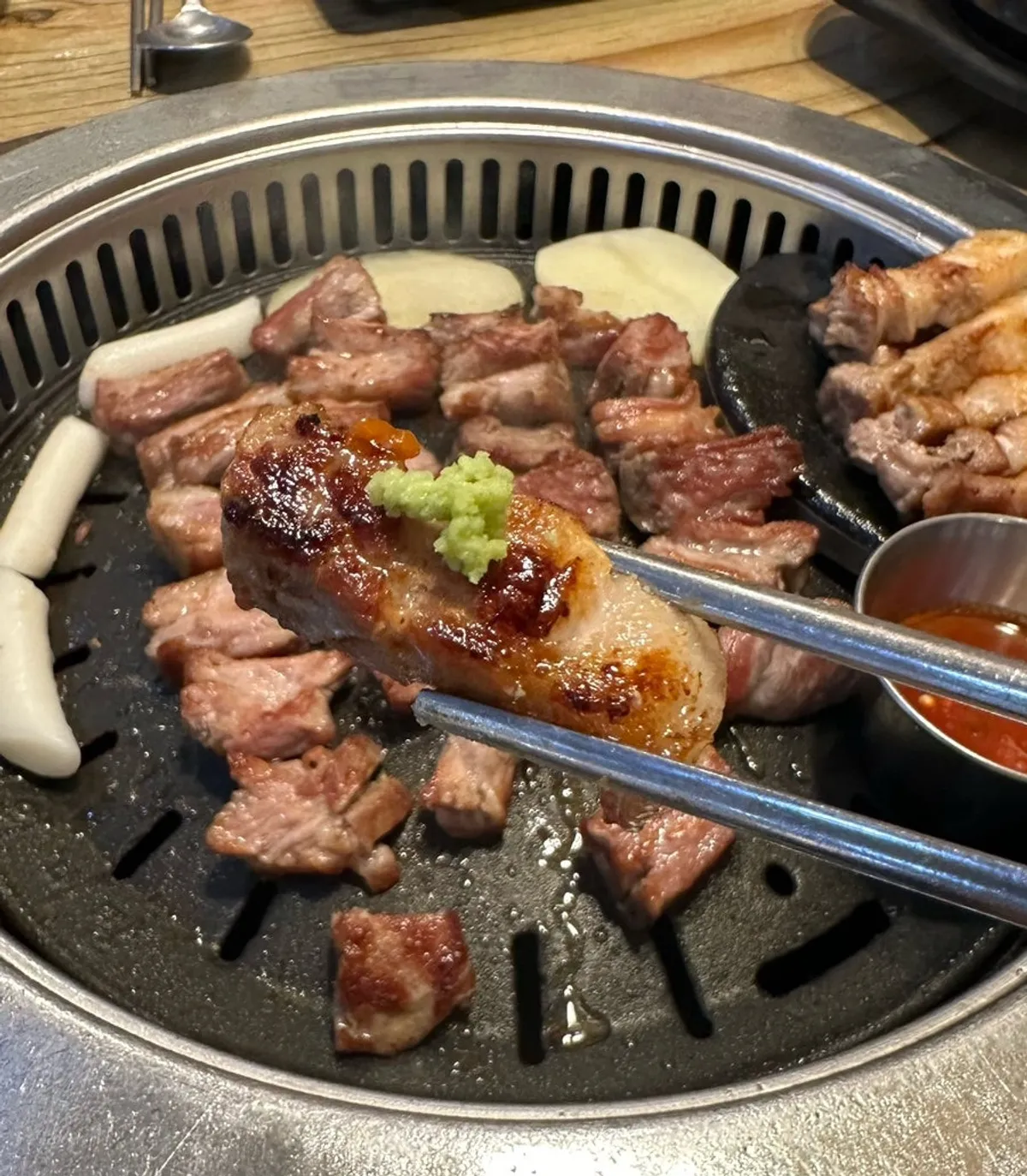 Grill spread with pork belly and side dishes