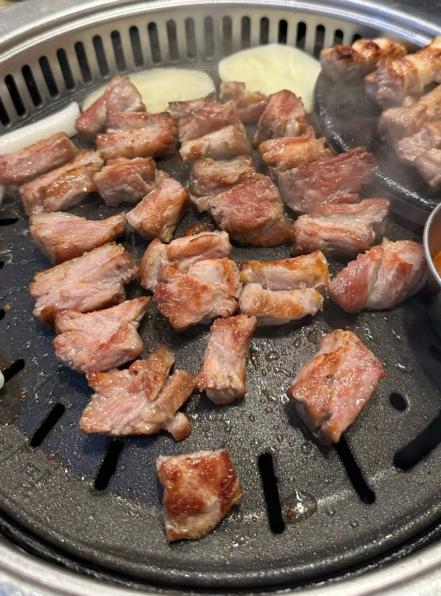 Cross-section of a thick-cut grilled pork neck piece