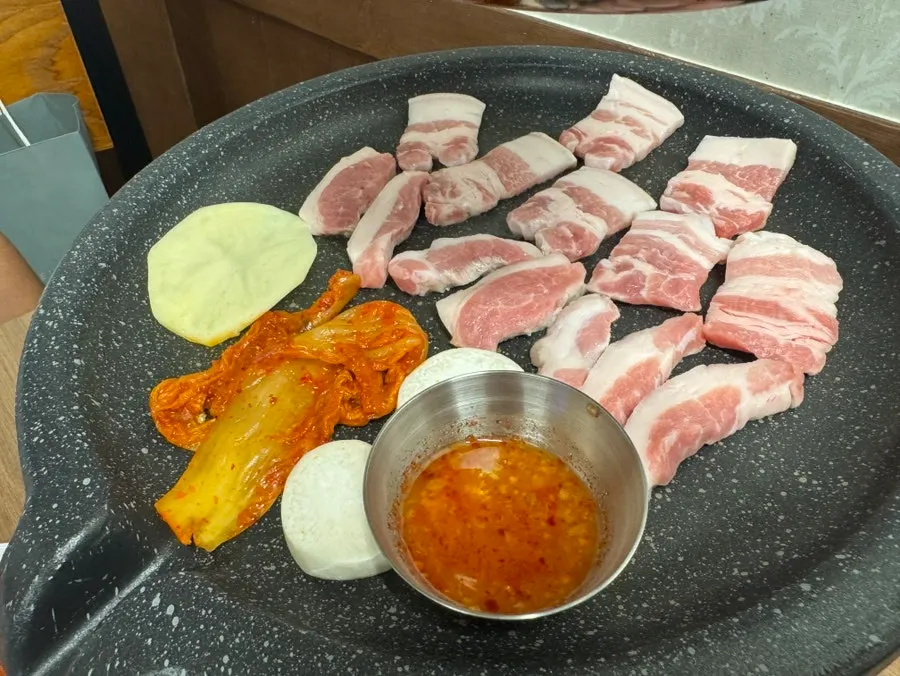 Pork belly grilling on the tabletop grill