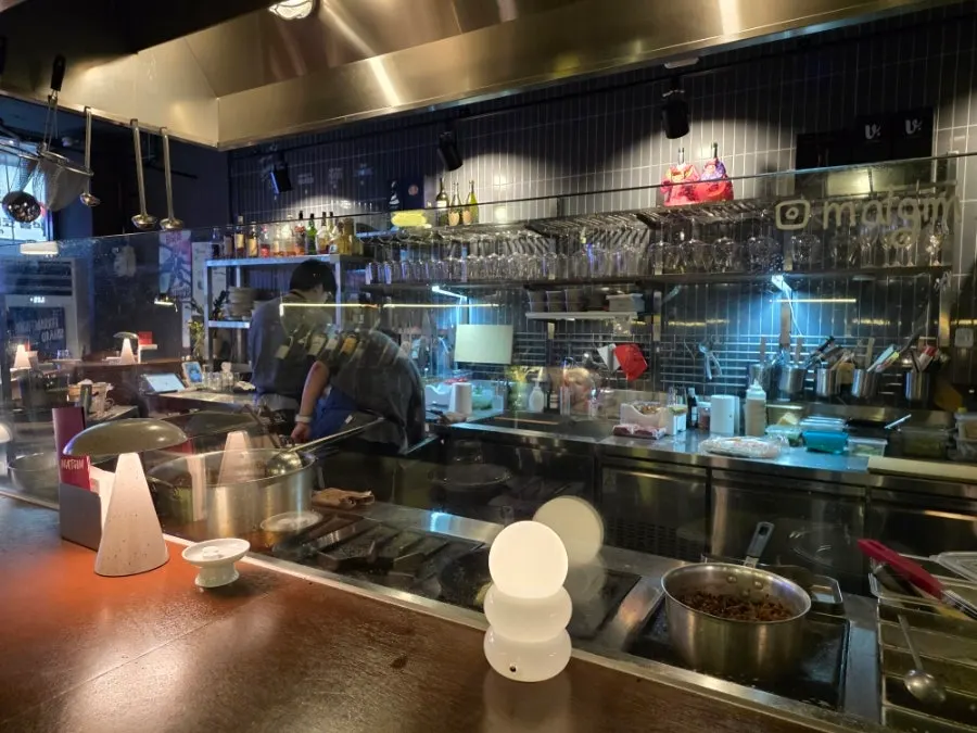View of Matgim's open kitchen from the counter seats