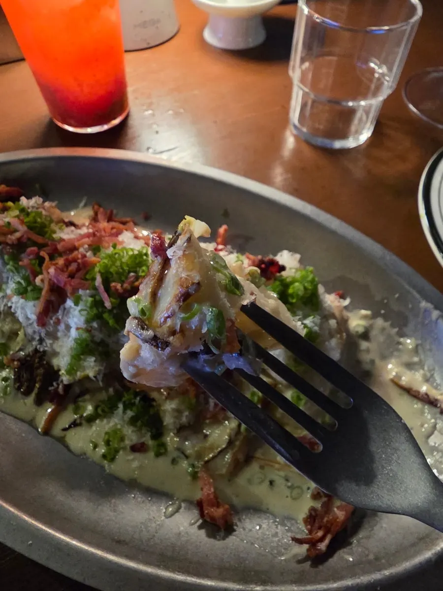 Cross-section of grilled baby cabbage with sauce