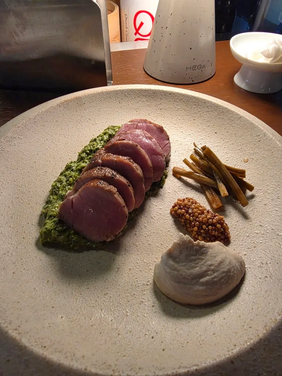 Sous vide pork tenderloin steak with accompanying sauces