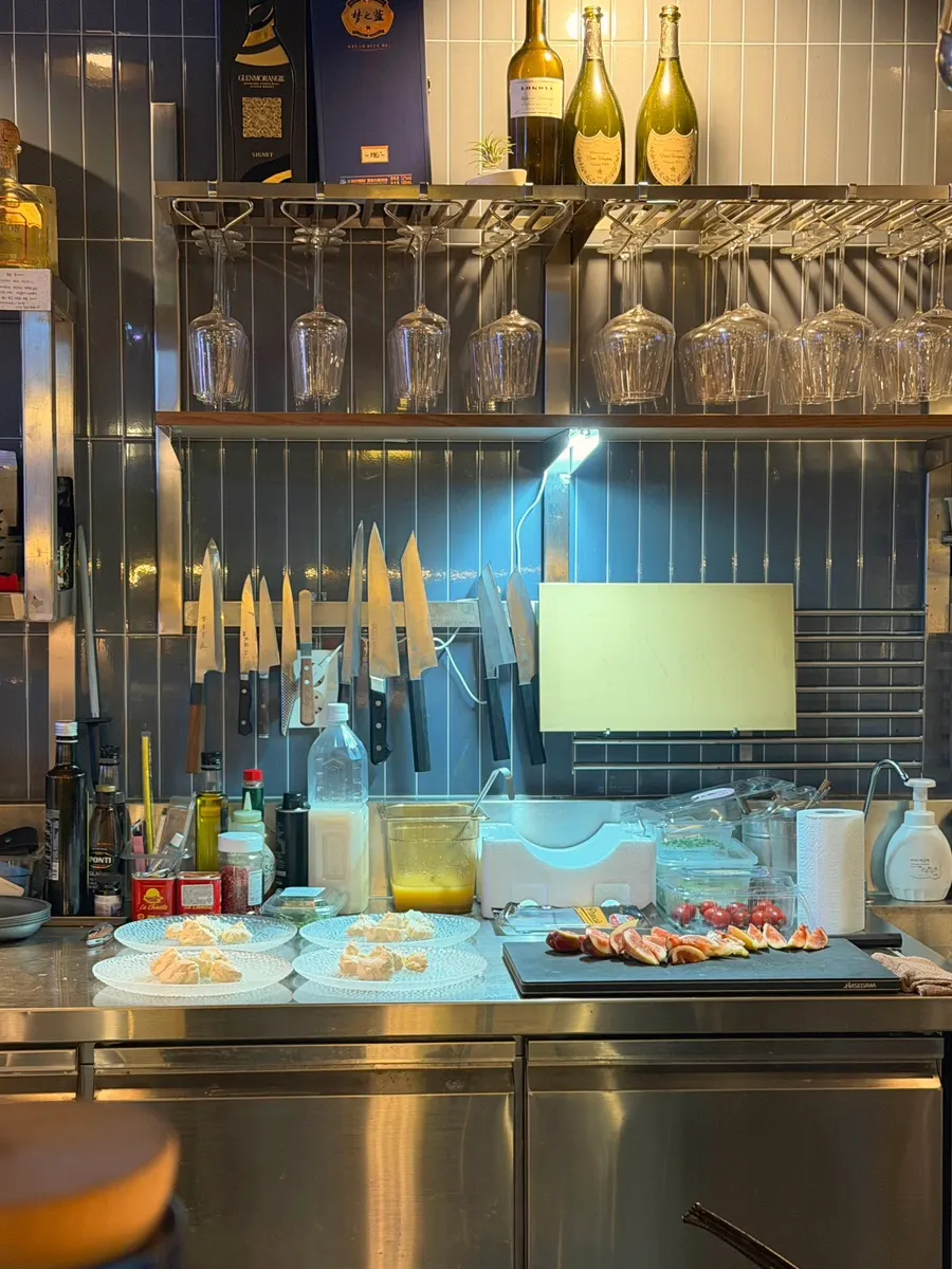 Chef preparing a salad behind the bar