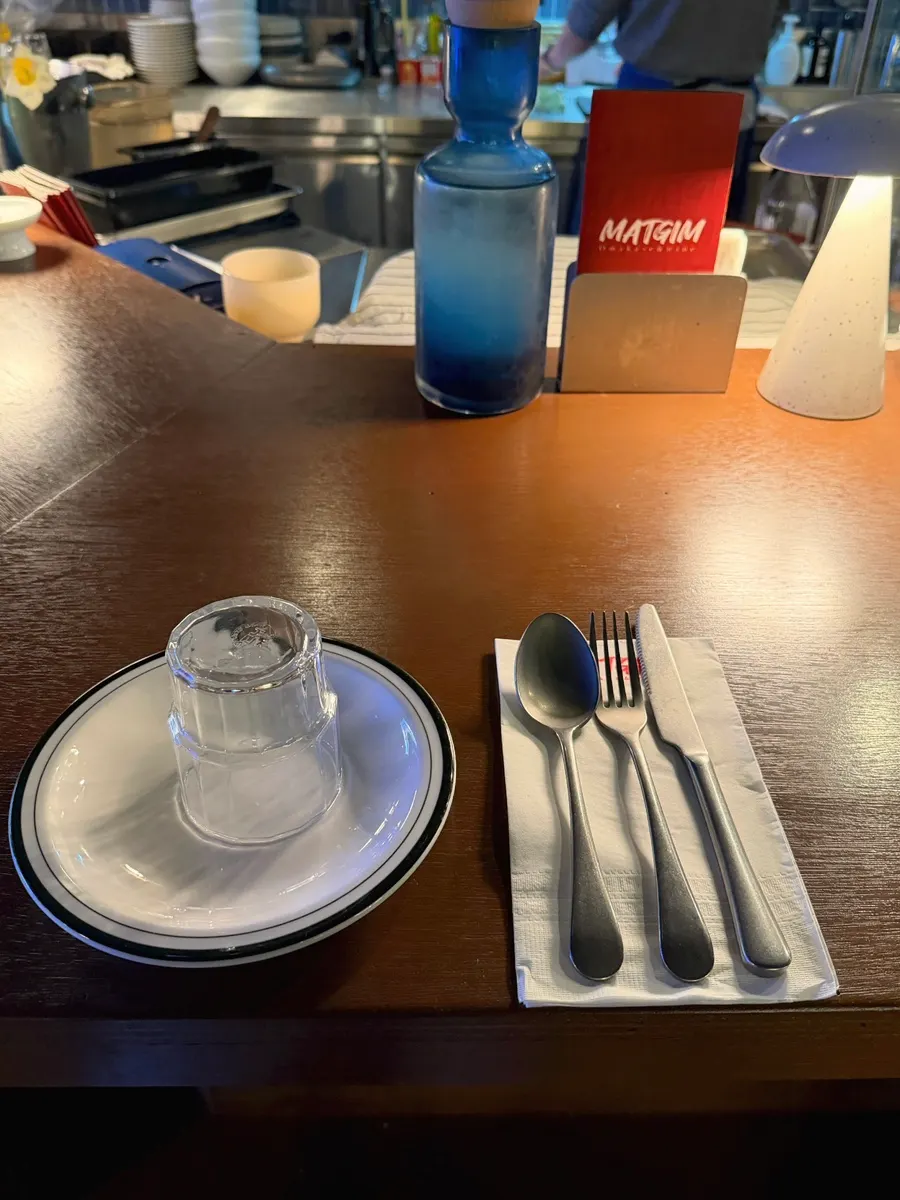 Neatly set bar table at Matgim