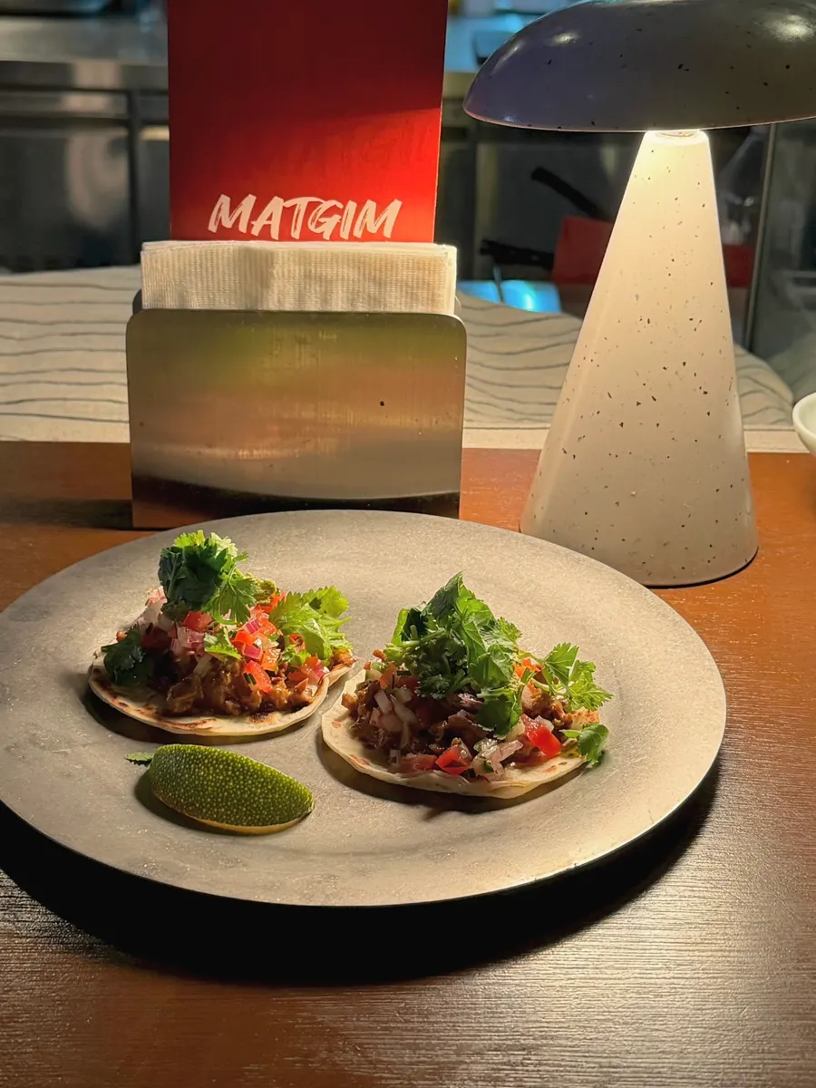 Tripe tacos topped with grilled tripe and cilantro