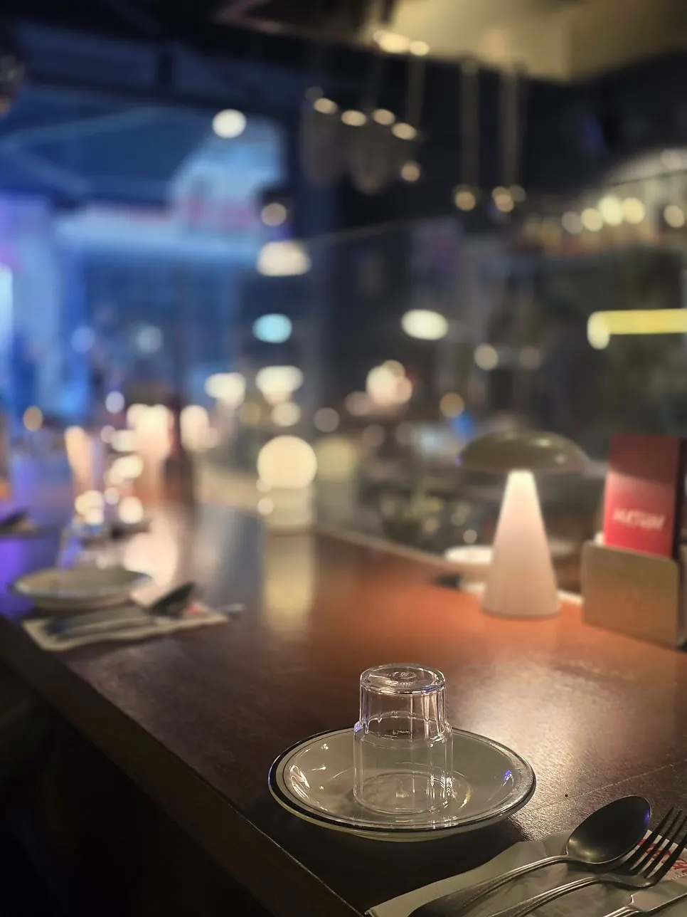Bar-table-focused seating inside Matgim