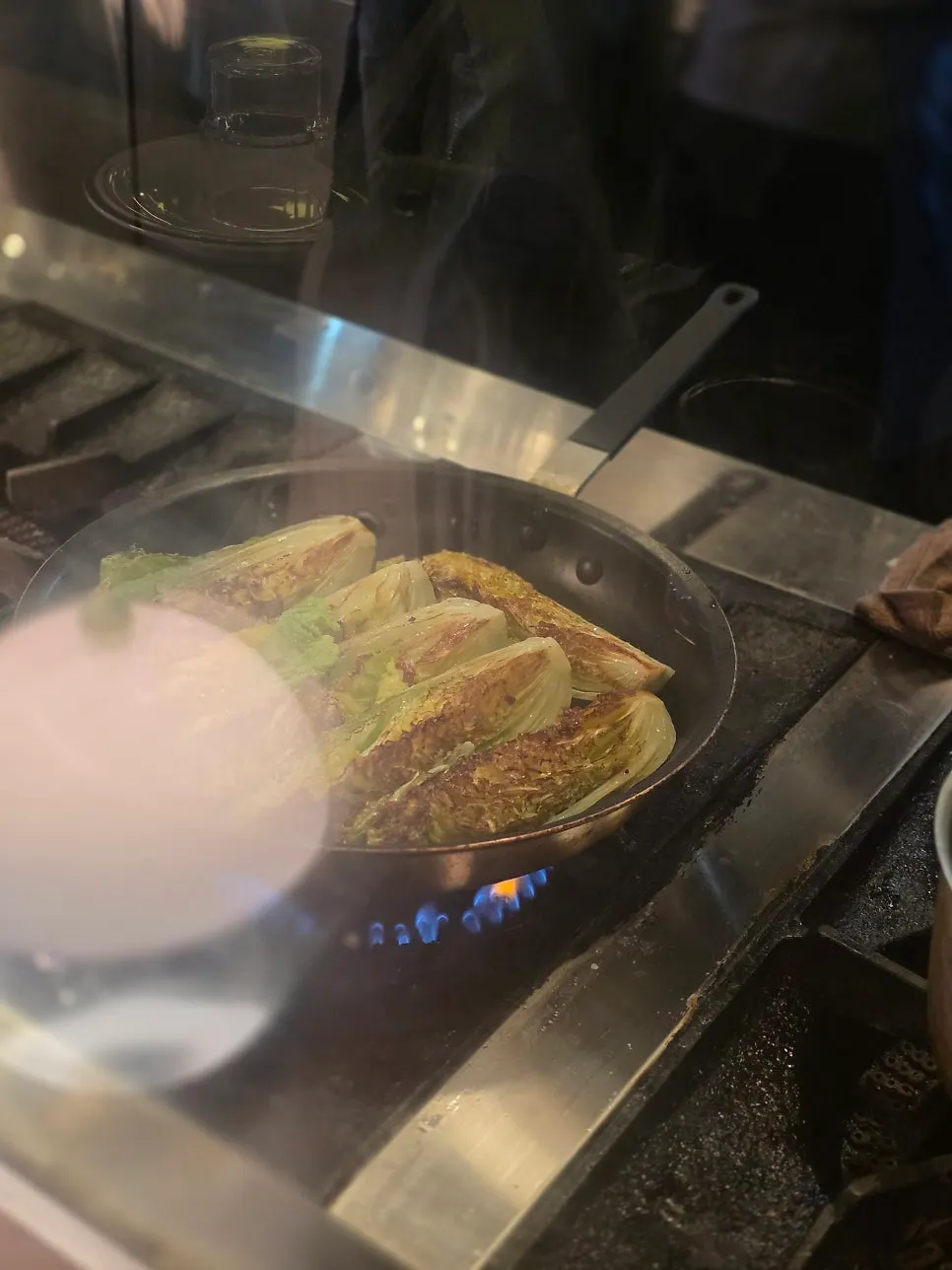 Matgim's grilled napa cabbage topped with cheese